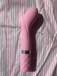 The pillow talk sassy vibrator in a soft pink. 